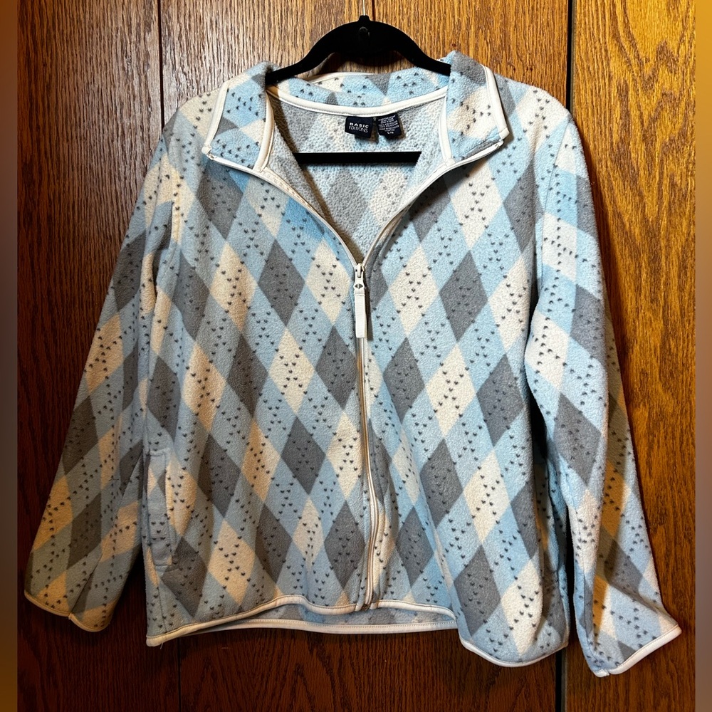 Light blue, grey, and white diamond patterned zip up. Size large.